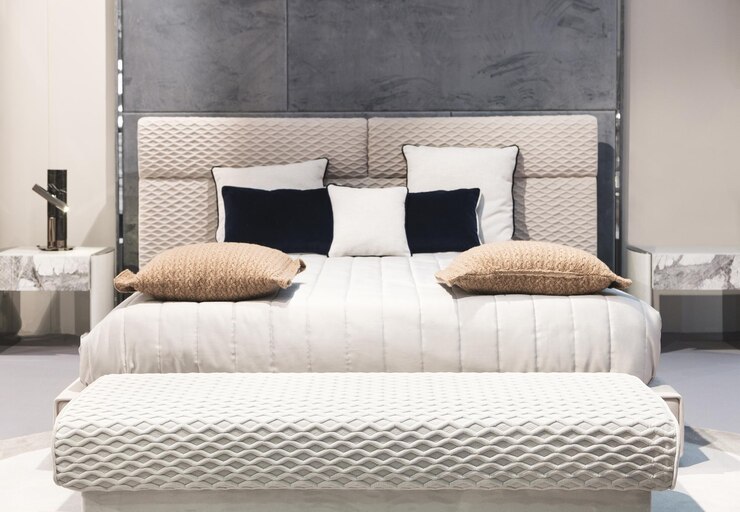 Classic interior design bedroom beige gray and blue Interior of a bedroom with cushions