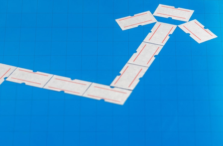 Photo climbing arrow made of price tags concept of rising prices and inflation