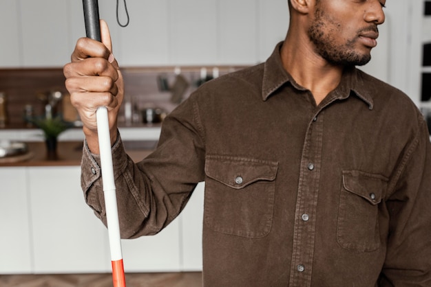 Close up man holding stick