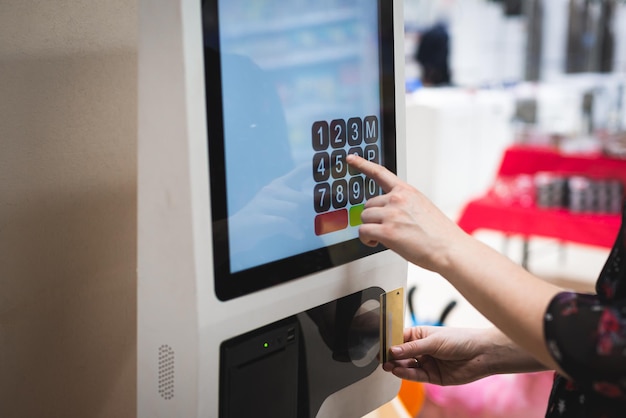 close-up of hand using credit card machine