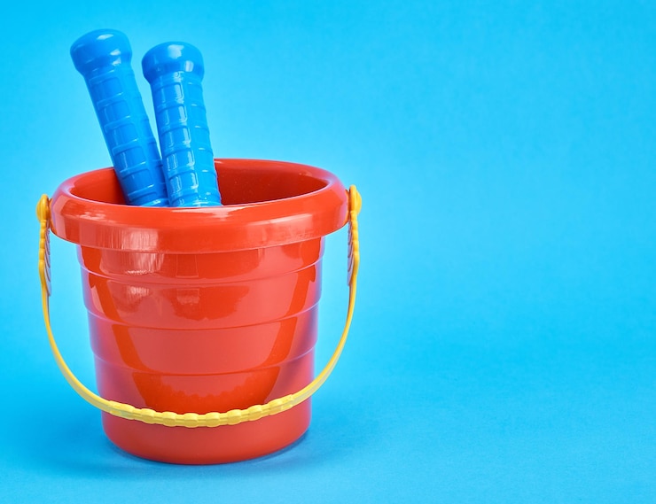 Photo close-up of plastic toys against blue background