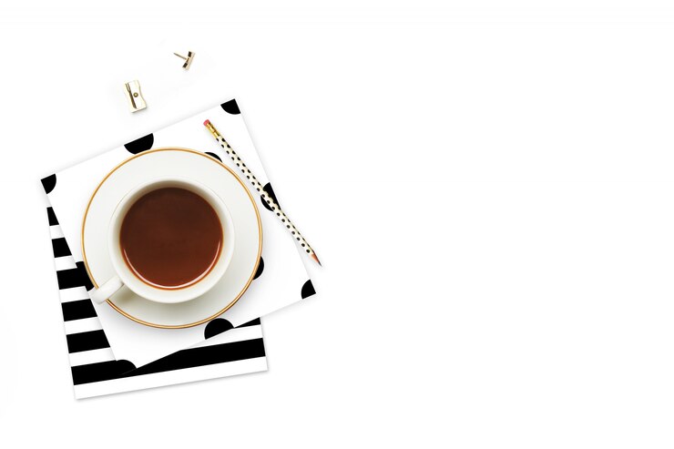 Coffee cup and items on the table. 