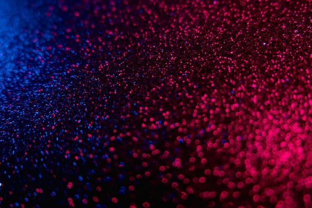 Colore bokeh bagliore glitter sfondo neon blu rosso