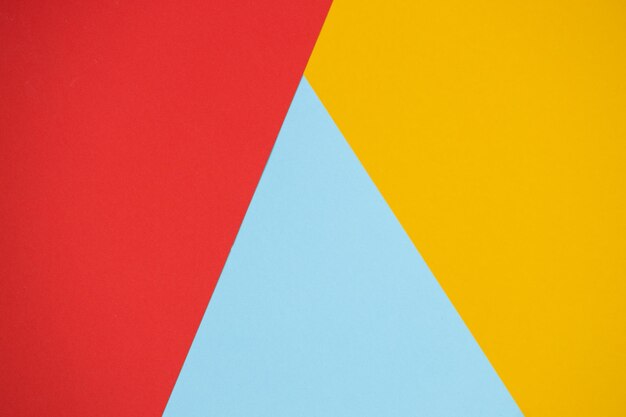 Colore della carta giallo rosso e blu per lo sfondo Forme geometriche della struttura del minimalismo