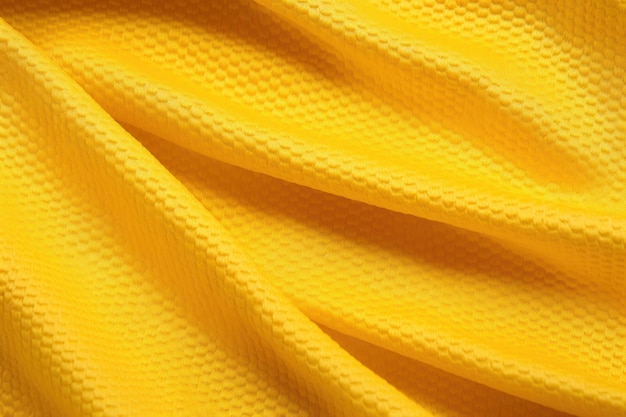 Colore giallo maglia da calcio abbigliamento tessuto texture abbigliamento sportivo sfondo primo piano