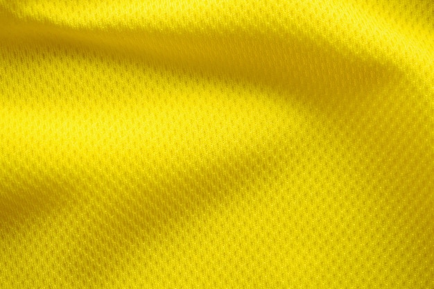 Colore giallo maglia da calcio abbigliamento tessuto trama abbigliamento sportivo sfondo, vicino