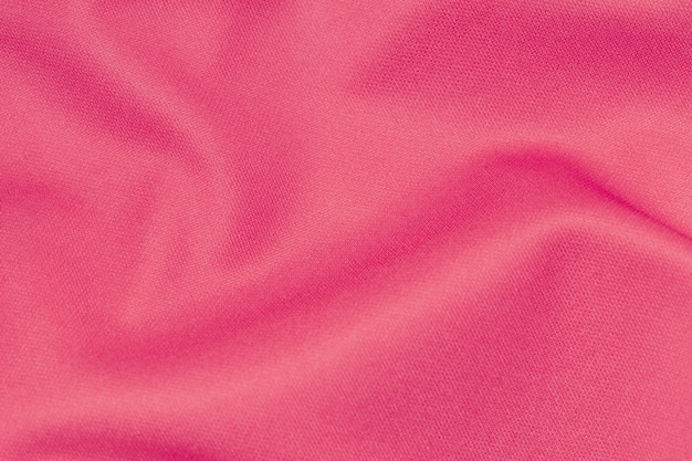 Colore rosa abbigliamento sportivo tessuto maglia da calcio texture e sfondo tessile.