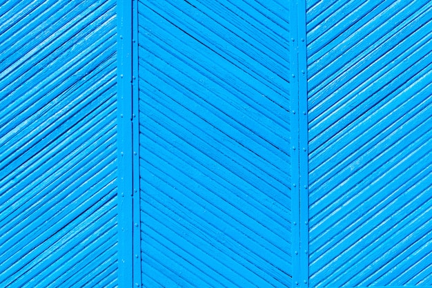 Colori blu del vecchio recinto misero di legno, fondo