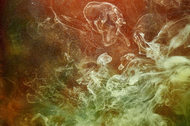 Colori vivaci dello spazio esterno modello oceano sfondo astratto Miscelazione di vernice e fumo liquido schizzi colorati e turbinio di gocce sfondo mistico subacqueo