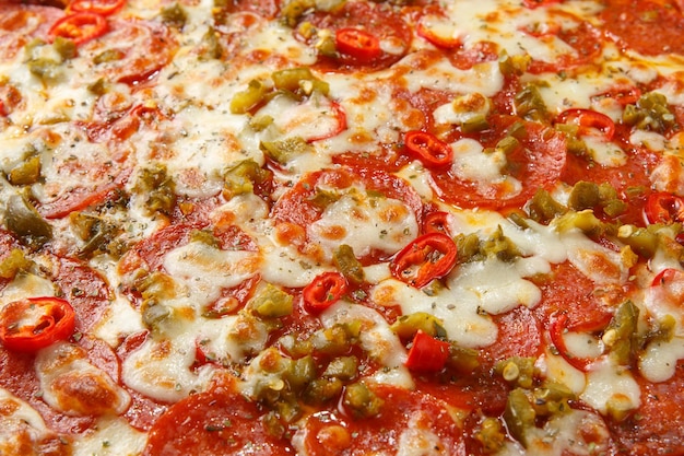 Colpo a macroistruzione del fondo della pizza della pizza italiana piccante