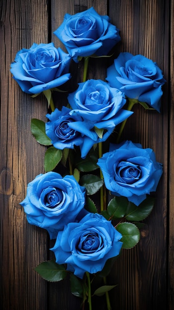 Composizione di rose blu su tavolo di legno