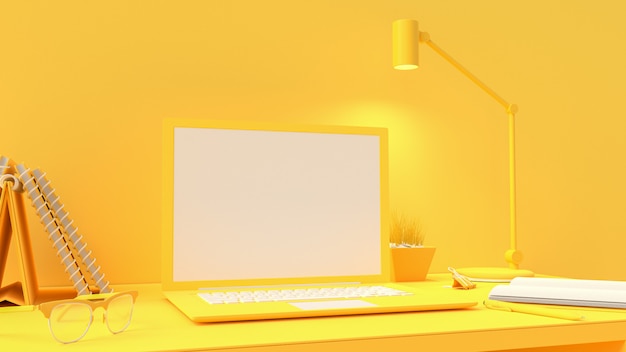 Computer portatile giallo su area di lavoro