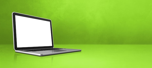 Computer portatile sull'insegna verde di scena dell'ufficio