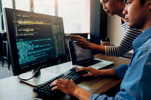 computer programmers coding in office
