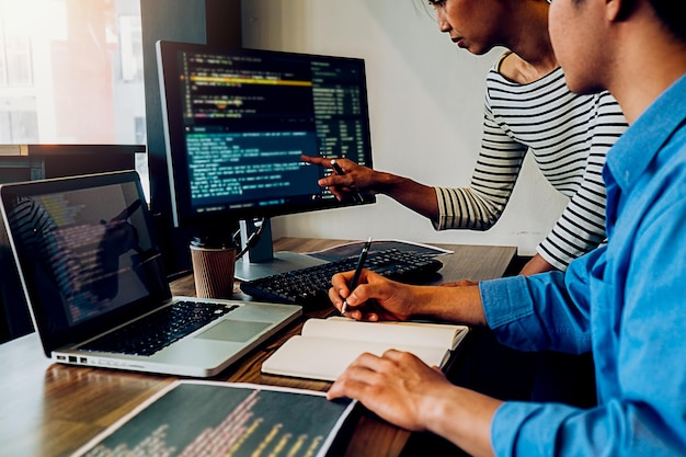 computer programmers coding in office