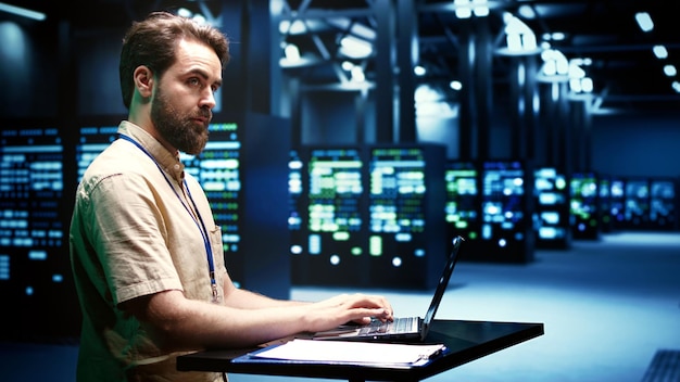 Computer scientist running server clusters diagnostic tests and error checking utilities to determine and mend software problems. Mechanic investigating critical systems, checking for faults