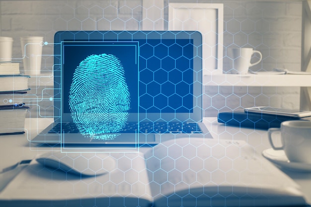 Computer sul desktop in ufficio con disegno di impronte digitali doppia esposizione concetto di sicurezza dei dati aziendali
