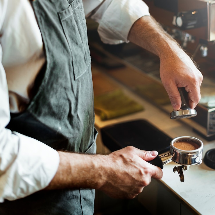Foto concetto del grembiule di occupazione del vapore del caffè di barista del caffè