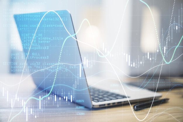 Concetto di analisi del mercato azionario aziendale con diagramma di grafici finanziari e numeri sullo schermo digitale sullo sfondo del laptop