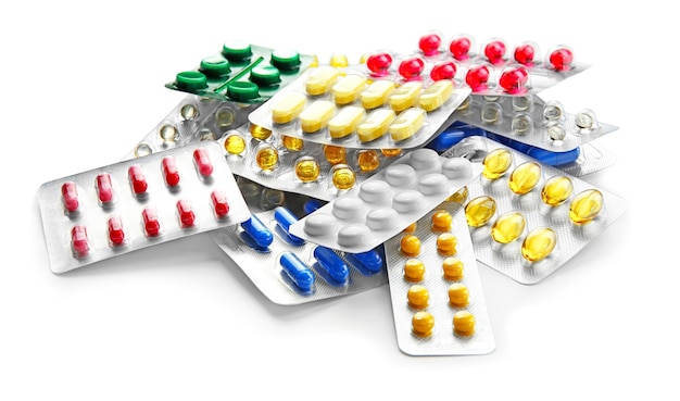 Concetto di assistenza sanitaria Blister con pillole su sfondo chiaro