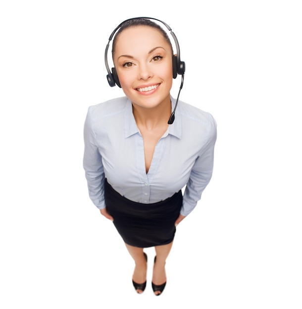 concetto di business e ufficio - amichevole operatore di assistenza telefonica femminile con le cuffie