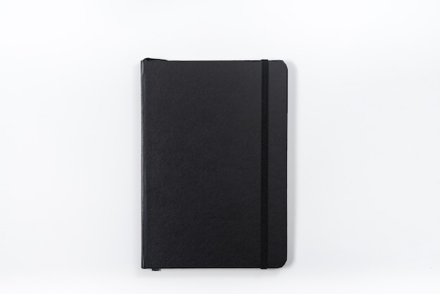 Concetto di business - vista dall'alto collezione di notebook nero su sfondo bianco scrivania per mockup