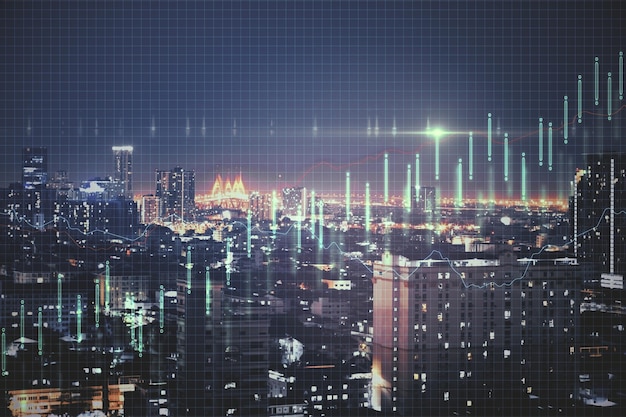Concetto di crescita con grafico aziendale sullo sfondo della città di megapolis di notte
