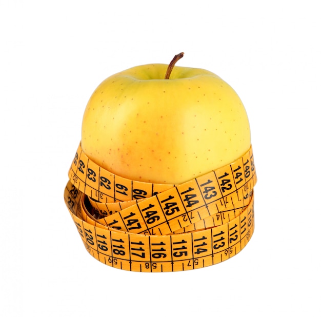 Concetto di dieta con mela verde avvolto con nastro di misurazione