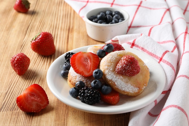 Concetto di gustose frittelle di formaggio dolce cibo