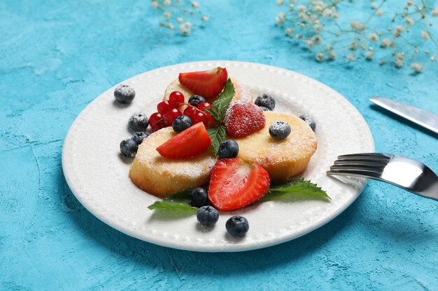 Concetto di gustose frittelle di formaggio dolce cibo