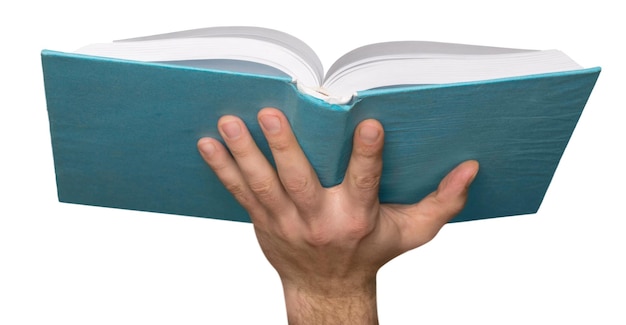 concetto di istruzione e libro - primo piano della mano della donna che tiene il libro verde aperto