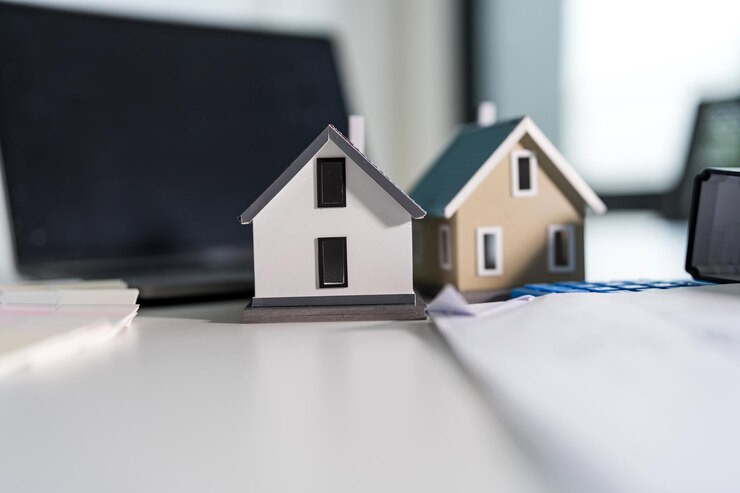 Foto concetto di pianificazione immobiliare con case in miniatura