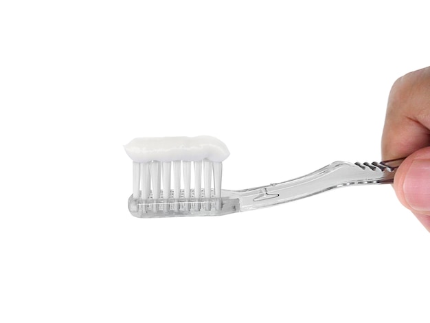 Concetto di simbolo di cura dentale dello spazzolino da denti della stretta della mano