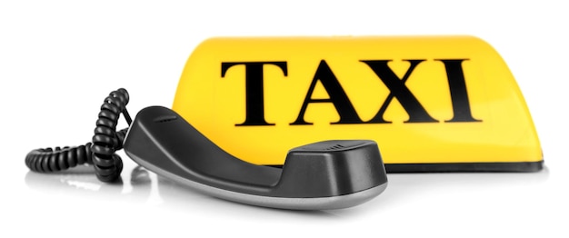Concetto di trasporto Cartello taxi giallo con ricevitore grigio isolato su sfondo bianco primo piano