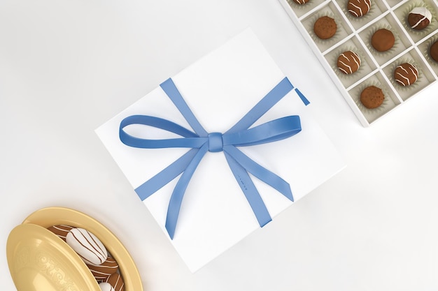 Confezione regalo Eid e vista dall'alto di cioccolato su sfondo bianco