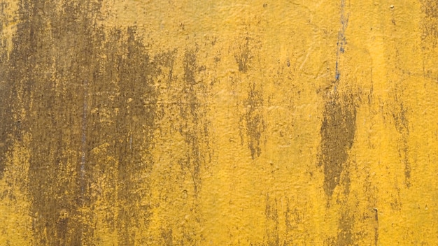 Consistenza del muro di cemento giallo