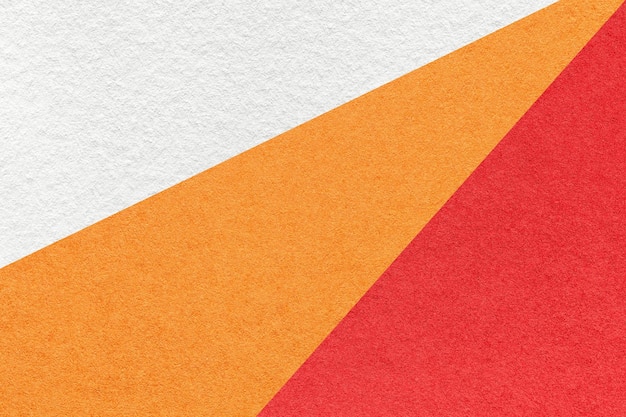 Consistenza del vecchio mestiere bianco rosso e arancio macro di sfondo della carta di colore Struttura di cartone astratto vintage