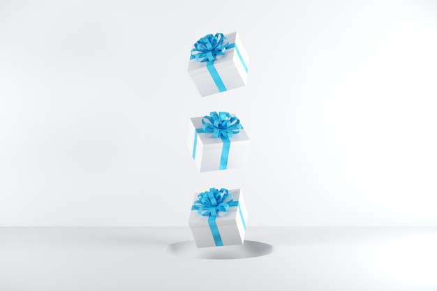 Contenitore di regalo bianco con colore blu del nastro che galleggia sul fondo bianco