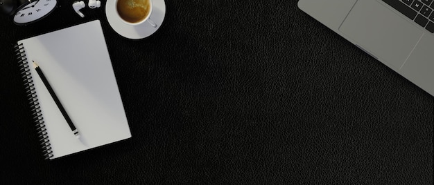 Copi lo spazio su fondo nero con il concetto moderno dell'area di lavoro del taccuino in bianco del computer portatile 3d render