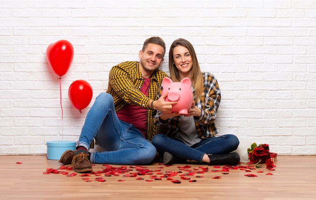 Coppia nel giorno di San Valentino all&#39;interno in possesso di un salvadanaio