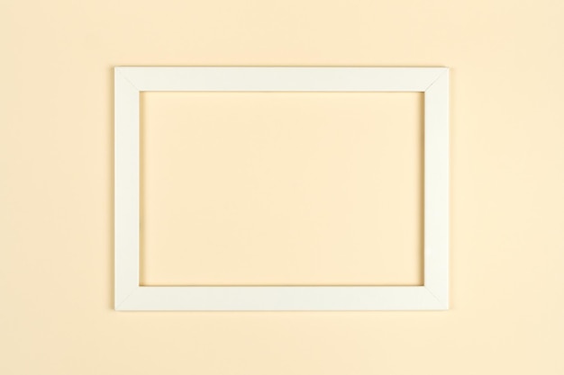Cornice astratta vuota piatta su sfondo di carta testurizzata color pastello Mockup minimalista di cornici