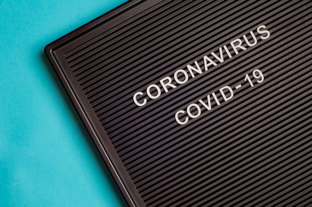 Coronavirus - COVID -19 - testo su lettera nera.