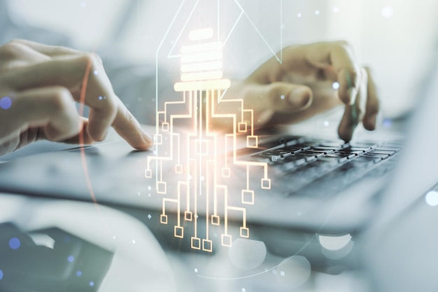 Creative idea concept with light bulb and microcircuit illustration and hands typing on laptop on background Neural networks and machine learning concept Multiexposure