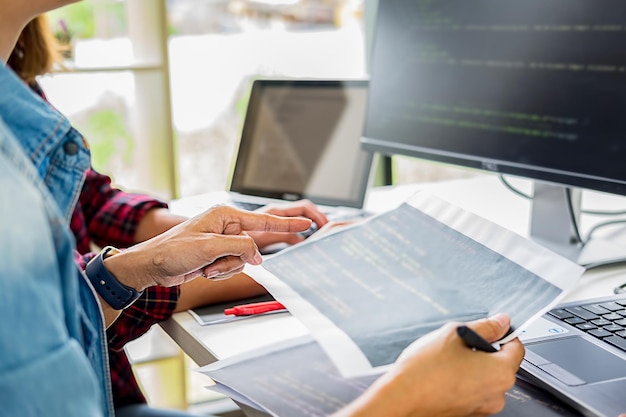 cropped image of male computer programmer coding in office