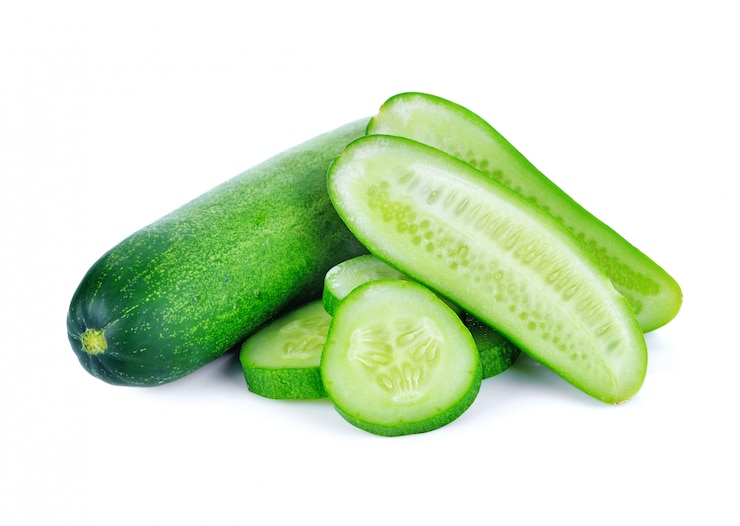 Photo cucumber and slices isolated over white background.