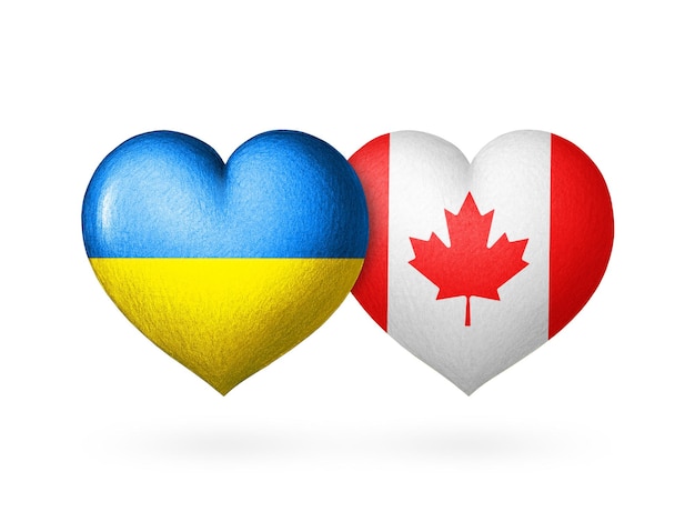 Cuore di due bandiere Bandiere di Ucraina e Canada Due cuori con i colori delle bandiere