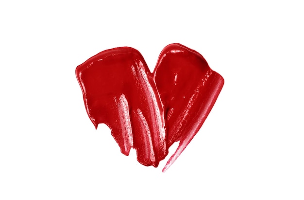 Cuore lucido da lipgloss.Beautiful cosmetici striscio.Isolato su bianco.L'amore compone il concetto.Simbolo di San Valentino.