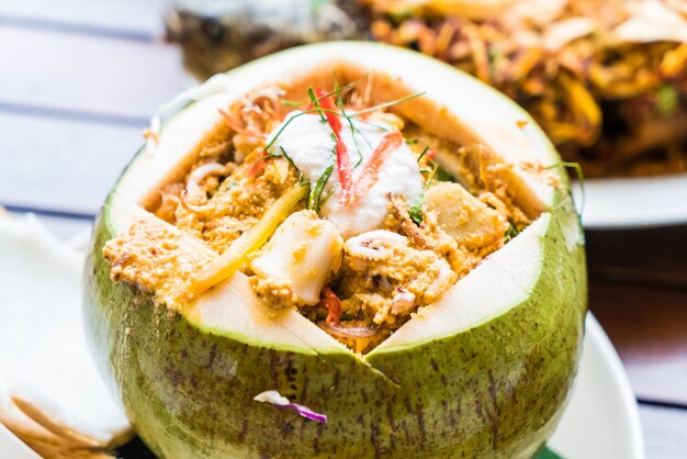 Curry Streamed Seafood in Coconut Cup