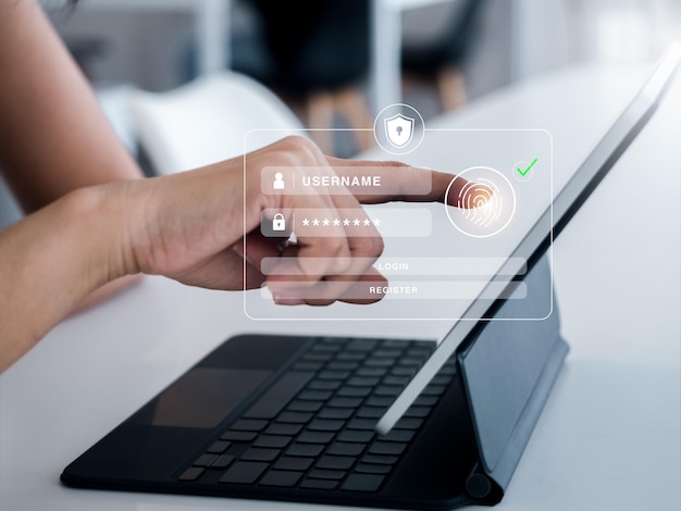 cyber security with biometrics authentication technology concept safety shield with finger scan icon on log in page virtual on tablet computer screen for validate password identity verification