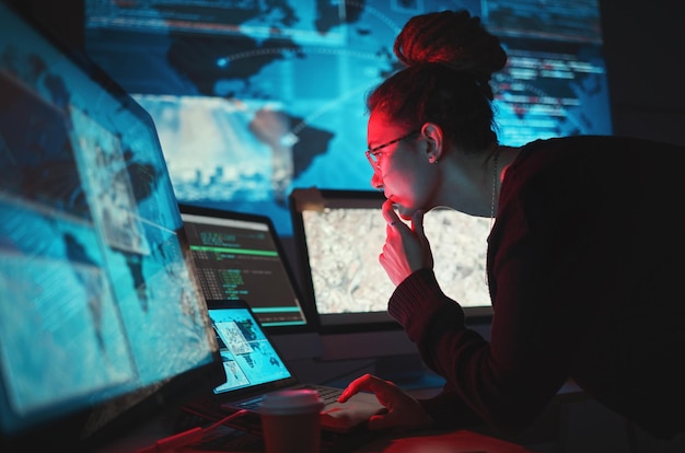 cybersecurity woman and computer with global network for phishing ransomware and cyber search maps digital database and it worker in dark room for virtual malware hacking fix of a employee back